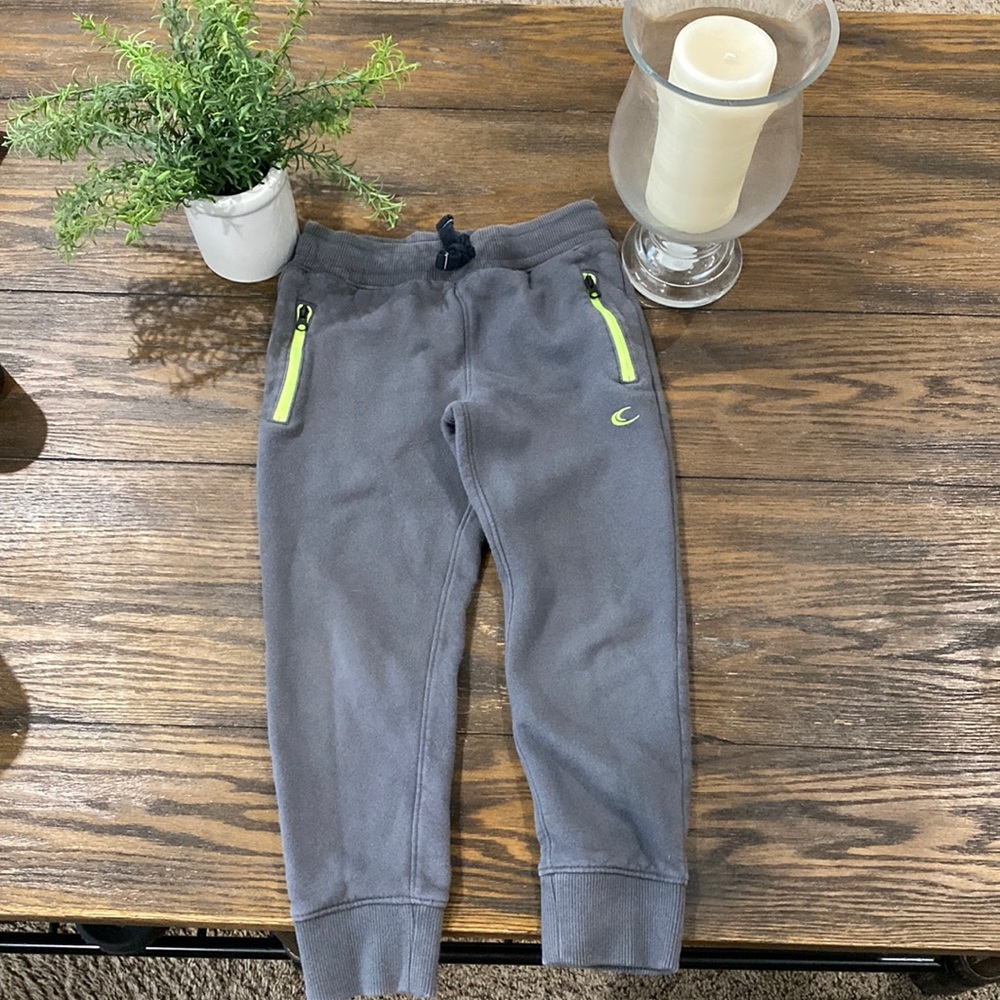 Carter’s gray and neon green sweatpants.